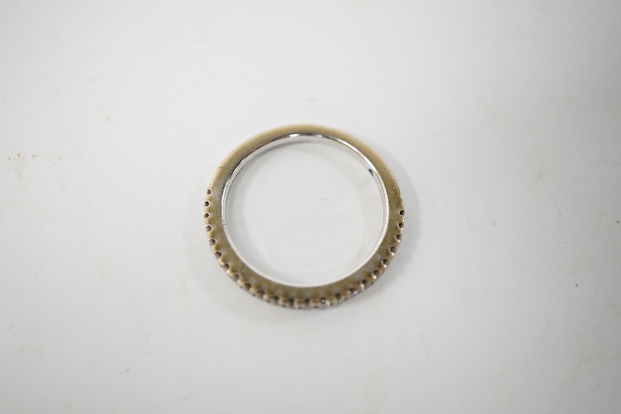 A modern Vera Wang 18ct white gold and diamond chip set half eternity ring, size K, gross weight 2.6 grams. Condition - good